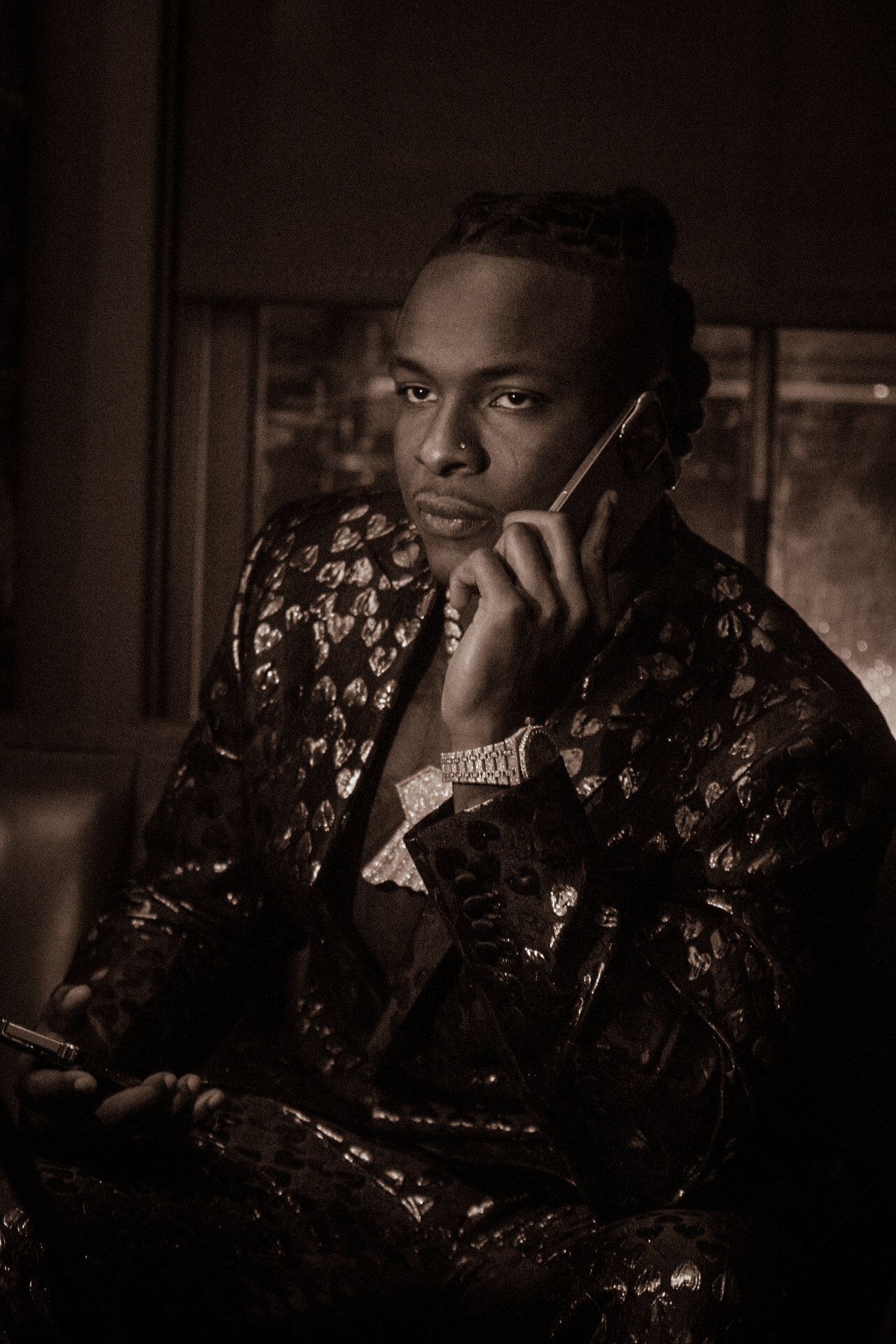 Moody portrait of a person on a phone