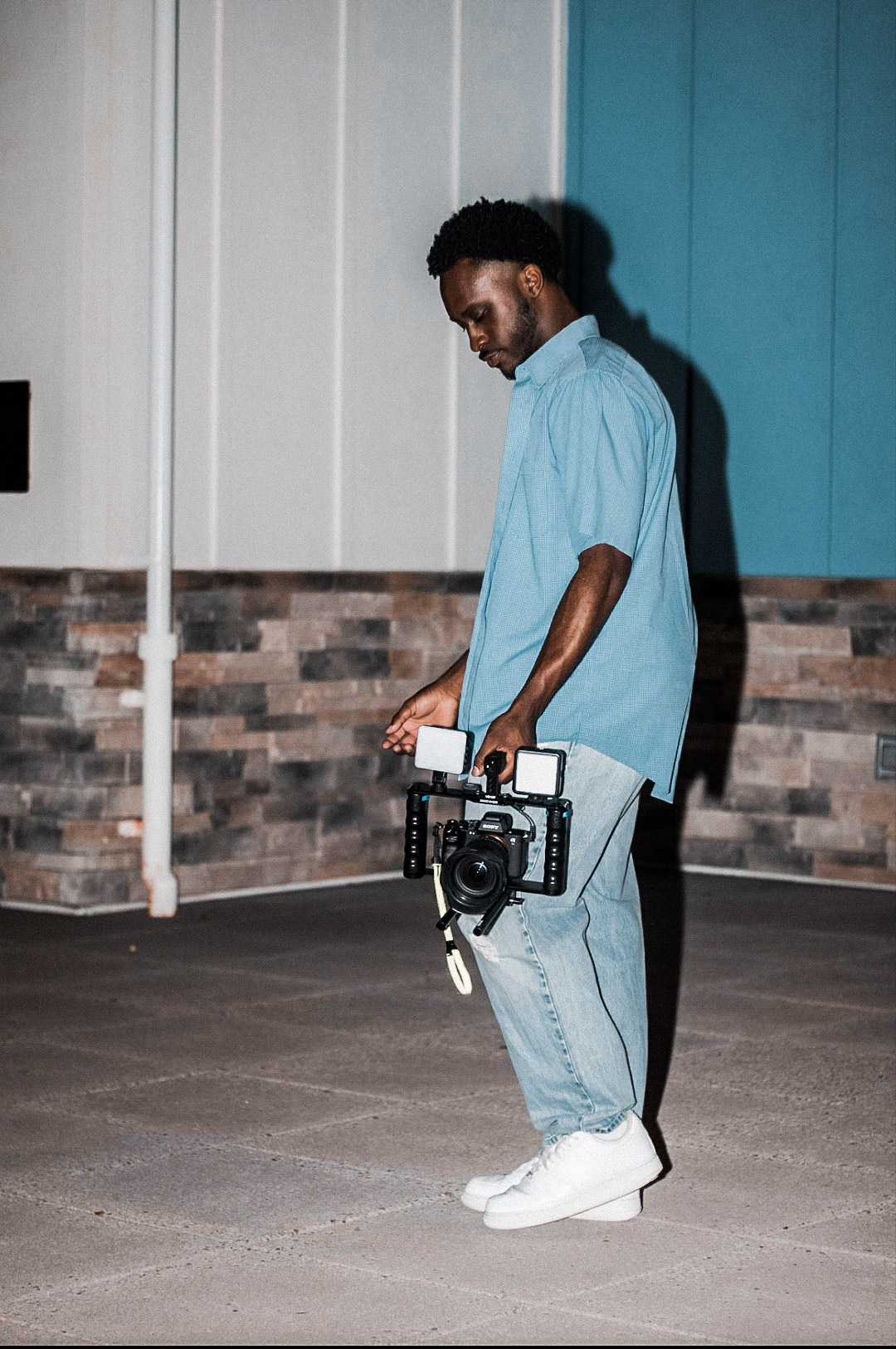 Jacob Parnell holding a video camera rig