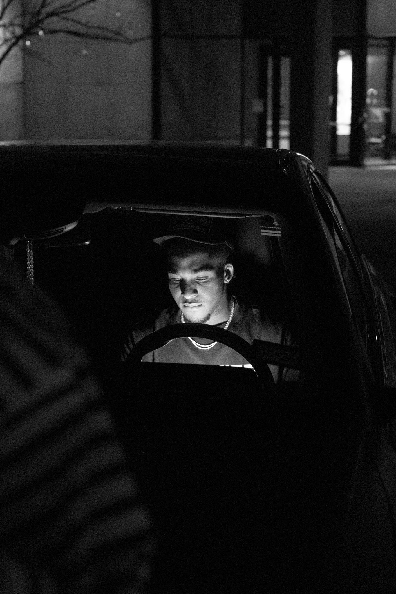 Black and white low-light portrait photographed by Jacob Parnell